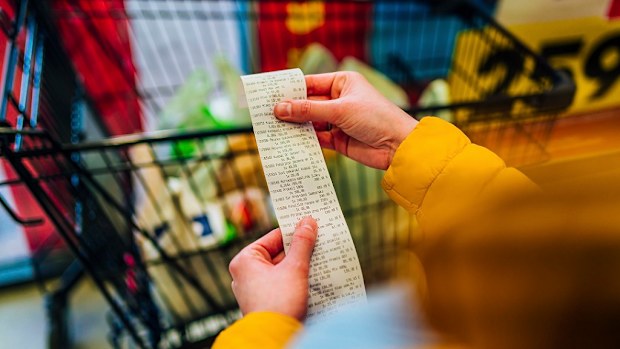 paying for groceries at the supermarket