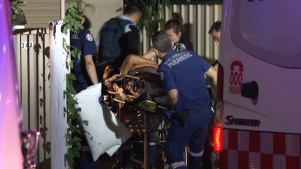 The man is assisted by paramedics. (9NEWS)