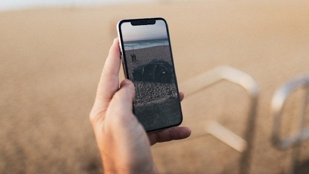 Person holding a smartphone in their hand 