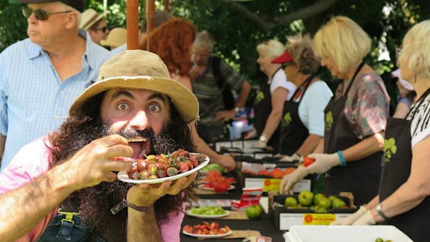 Television personality Costa Georgiadis enjoys the free taste test. (AAP)
