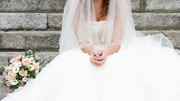 Bride sad sitting on steps