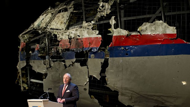 The rebuilt fuselage of Malaysia Airlines flight MH17 during a press conference to present the report findings of the Dutch Safety Board in Gilze Rijen. (AAP)
