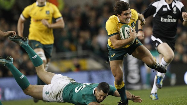 Wallabies halfback Nick Phipps breaks through for a try against Ireland. (AAP)
