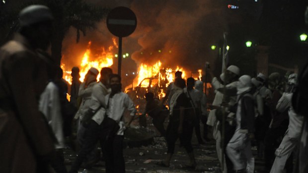 Indonesian police say one person has died after protests turned violent. (AAP)