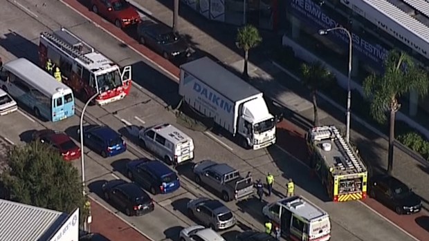 The woman was hit while trying to cross the busy road. (9NEWS)