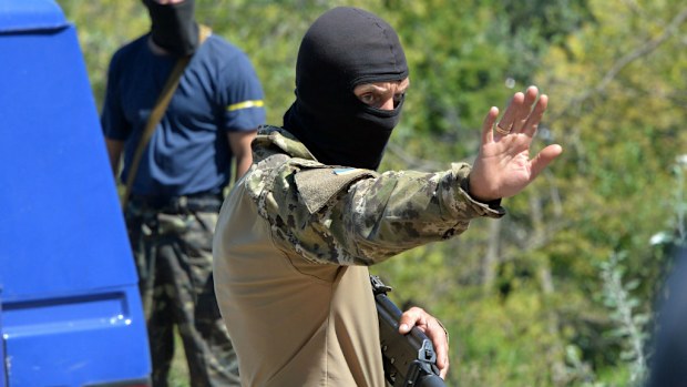 Cars were stopped and searched near the eastern Ukrainian city of Lisichansk. Ukraine's army seized control of part of the vast site where Malaysian airliner MH17 crashed, insurgents said.