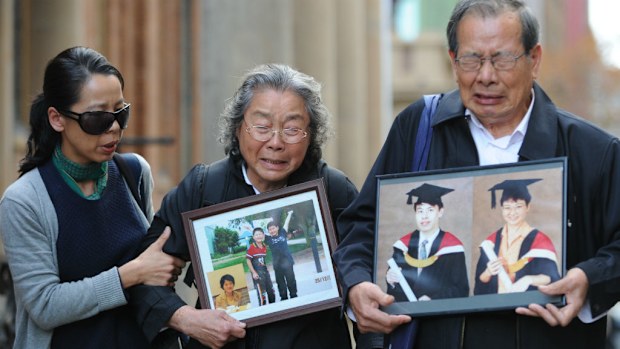 Kathy Lin with her parents Yang Fei Lin and Feng Qing Zhu leave the Supreme Court in Sydney where Robert Xie is standing trial accused of murder. (AAP)