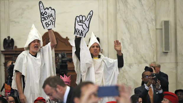 Protesters interrupt the hearing. (AAP)