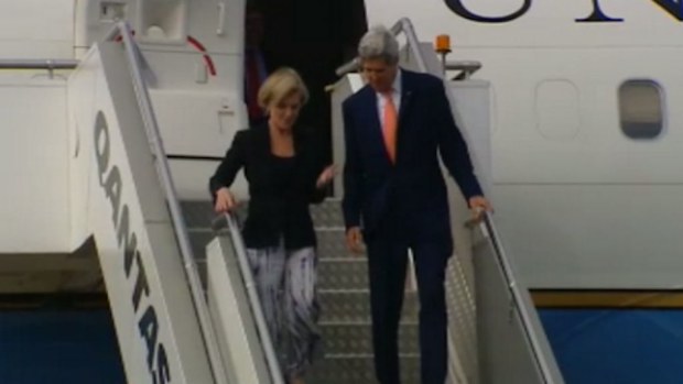 US Secretary of State John Kerry exits a plane with Australian Foreign Minister Julie Bishop.