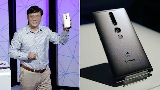 Lenovo Chairman and CEO Yuanqing Yang holds up the new Phab2 Pro phone during the keynote address at the Lenovo Tech World event on June 9, 2016, in San Francisco. (AAP)