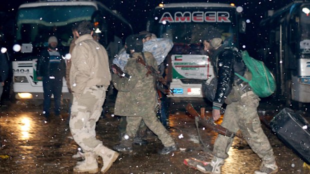 A convoy, evacuating civilians and opposition group members who left east Aleppo arrive in opposition-controlled Rashideen, Syria on December 22, 2016. (AFP)