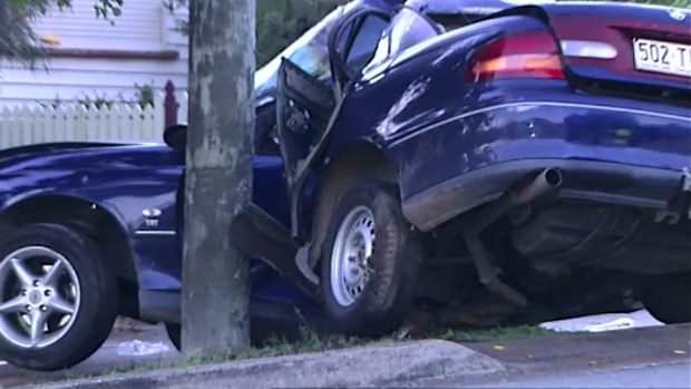 A car wrapped around a power pole at Sadliers Crossing, Ipswich, today. (9NEWS)