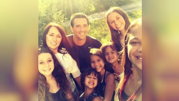 Laura and Rico Ruffino, who have two daughters of their own, have adopted the four daughters of Mrs Ruffino's best friend Elizabeth Diamond. (Supplied)