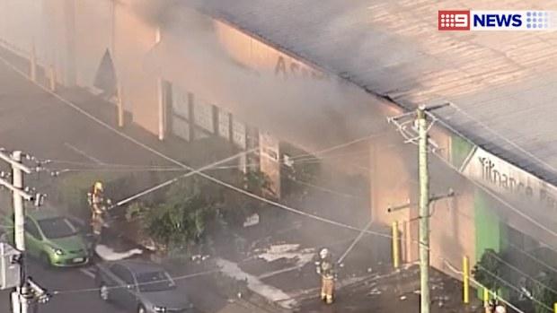 Firefighters battle the blaze. (9NEWS)