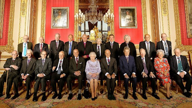 Queen Elizabeth II (front, centre) with members of the Order of Merit. (AAP)