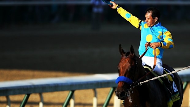 Jockey Victor Espinoza celebrates atop American Pharaoh after winning the Kentucky Derby. (Getty)