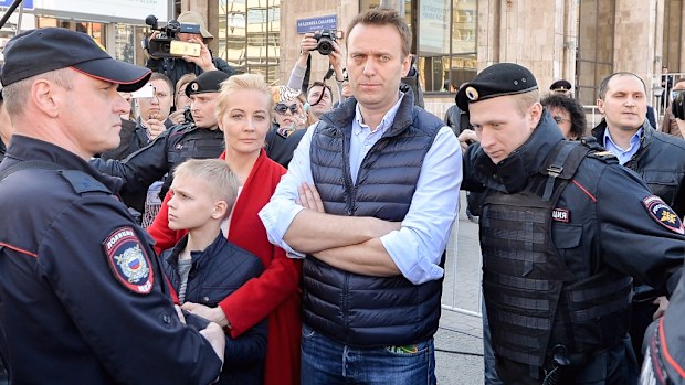 Opposition leader Alexei Navalny has reportedly been detained at the entrance of his home before a rally in Moscow. (AFP)