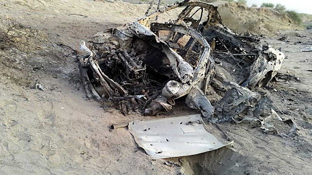The destroyed vehicle in which Mullah Mohammad Akhtar Mansour was traveling in the Ahmad Wal area in Baluchistan province of Pakistan, near Afghanistan's border. (AAP)