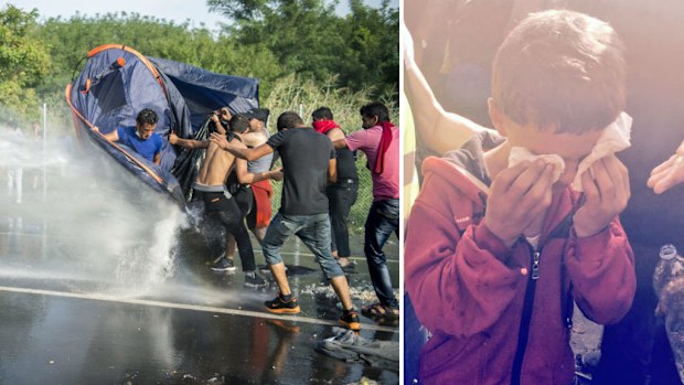 Water cannons soak protesters and a young buy is affected by the tear gas.