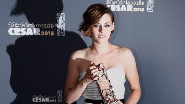 US actress Kristen Stewart poses with the Best Performance by an Actress in a Supporting Role award for 'Sils Maria' during the 40th annual Cesar awards ceremony held at the Chatelet Theatre in Paris, France. (AAP)