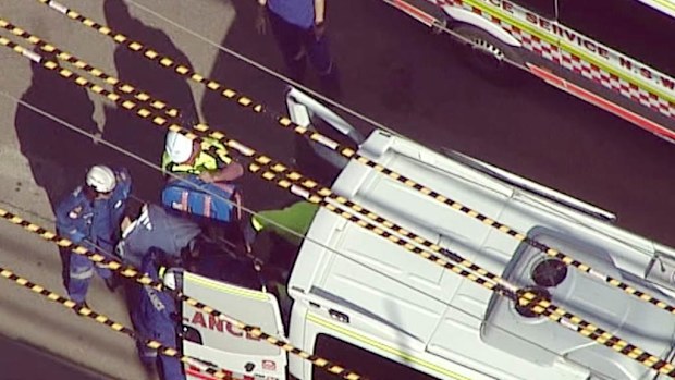 A worker is put into an ambulance at a building site in Liverpool. Picture: 9NEWS