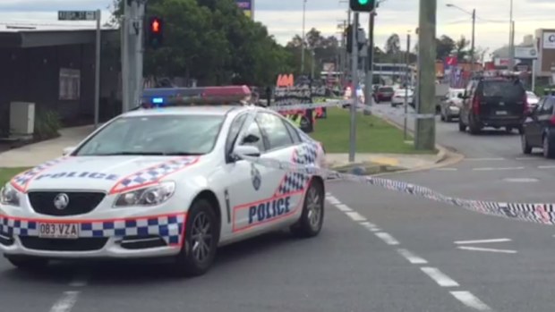 Police outside the West Ipswich complex. (9NEWS)