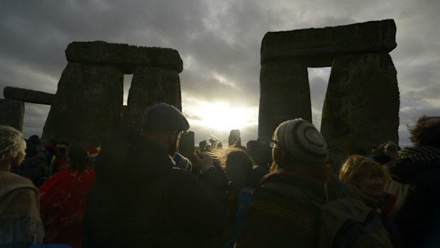 People gather at Stonehenge in Wiltshire on the Winter Solstice to witness the sunrise. (Ben Birchall/PA Wire)