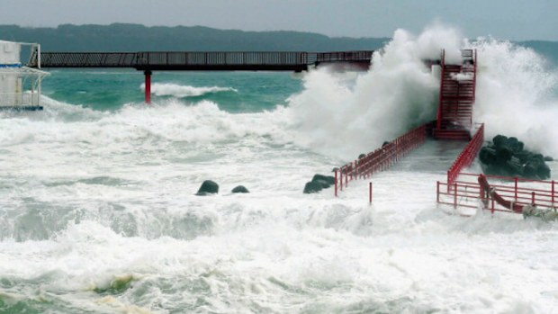 High waves triggered by Typhoon Halong hit the underwater observation tower of the Kushimoto Marine Park on August 9, 2014 .  (Photo by The Asahi Shimbun via Getty Images)