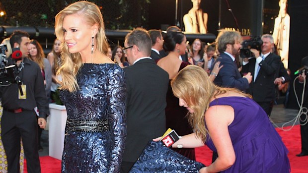 Sonia Kruger being helped with her dress at the Logies in 2013.