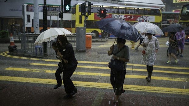 Hong Kong is battered by rain as it prepares for Typhoon Haima. (AFP)