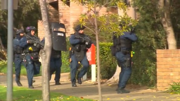 Police storm a building in Adelaide's CBD where suspected robbers had been engaged in a standoff with police. (9NEWS)