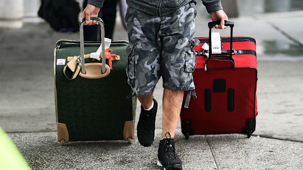 Arriving passengers make their way from Terminal Four at the JFK airport in New York. The airport started health screenings for travelers arriving from Ebola-hit West African nations.