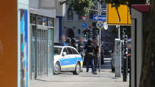 Police wait outside the restaurant in Saarbruecken. (AFP)
