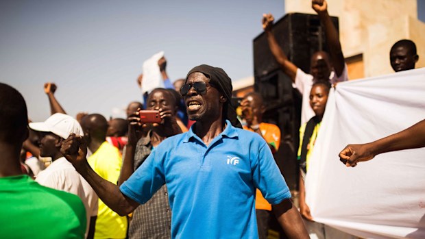Burkina Faso's new military leader is coming under growing pressure to hand over power to a civilian government. (AAP)