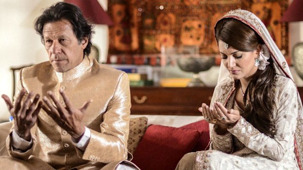 Imran Khan with his bride Reham Khan, praying during a ceremony at Khan's home in Islamabad. (AAP)