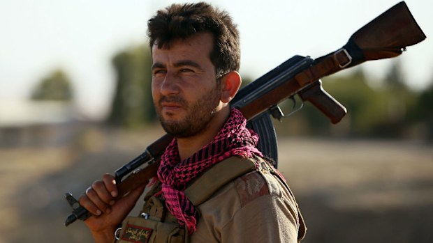 An Iraqi Peshmerga fighter takes position at a post near the jihadist-held city of Zumar in Mosul province, Iraq. (Getty Images)