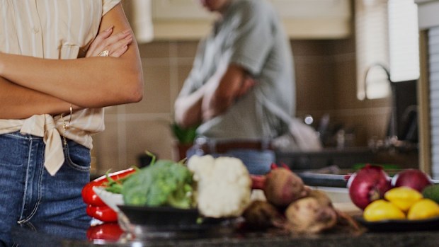 Married couple in kitchen food prep