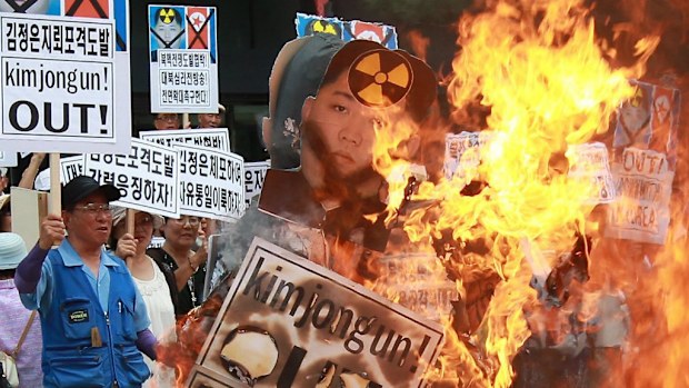 South Korean protesters burn effigies of Kim Jong-un. (AAP)