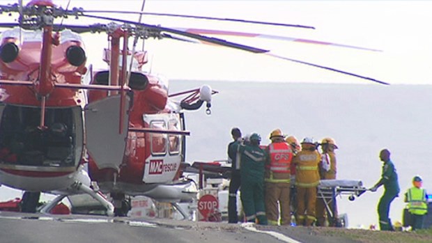 Paramedics airlift several of the injured passengers. (9NEWS)