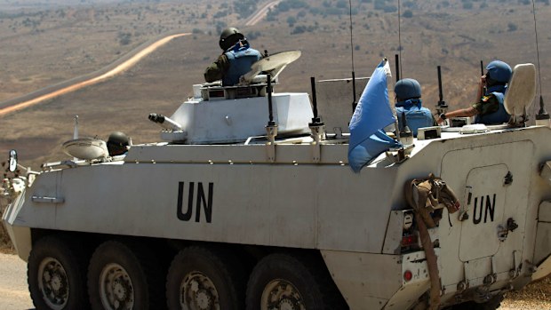 UN peacekeeper troops waiting for the Israeli army to cross into Syria, near the Druze village of Buqata. (EPA/ATEF SAFADI)
