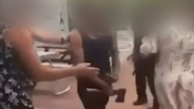 Two men have stormed a school in Perth allegedly armed with weapons.