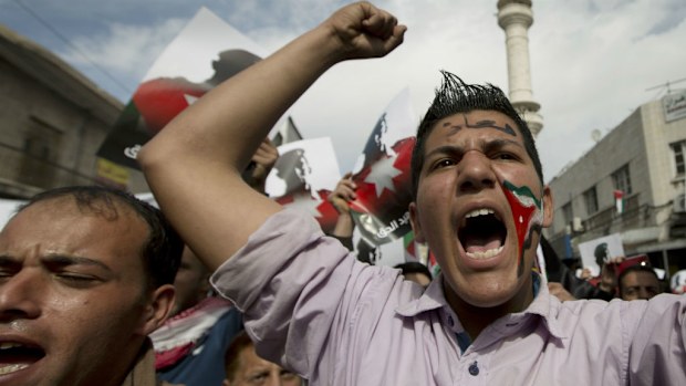 Demonstrators chant anti-Islamic State group slogans during a rally in Amman, Jordan. (AAP)