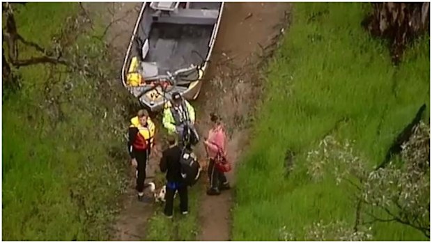 A man, woman and three dogs had to be rescued after being surrounded by floodwaters in Toolamba. (9NEWS)