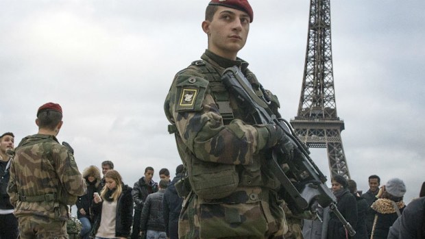 French soldiers patrol near the Eiffel Tower in Paris. (AAP)