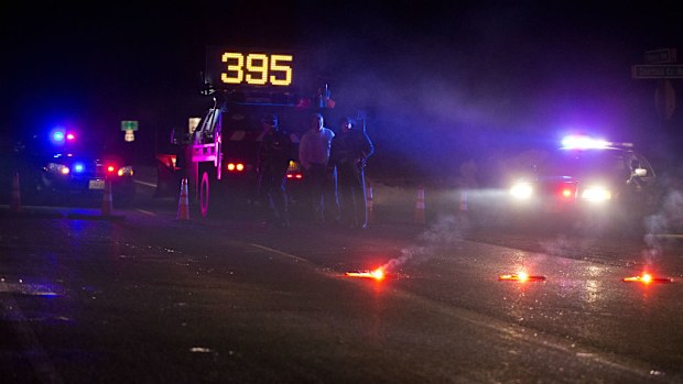 Oregon State police officers close part of Highway 395 in Seneca. (AAP)