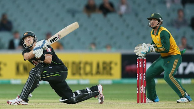 Shane Watson smashes a six in Australia's loss to South Africa in a Twenty20. (AAP)