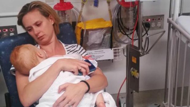 Noami Holly with her baby who was taken to hospital when she was struggling to crawl. (Supplied)