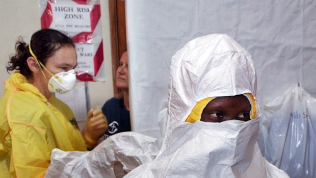 Aid workers don protective gear as the Ebola virus sweeps through West Africa. (Getty Images)
