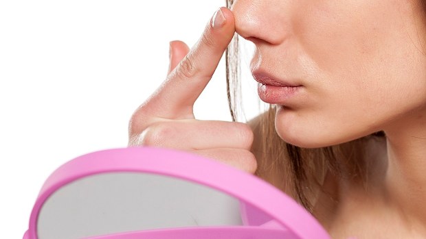 Woman looking at nose