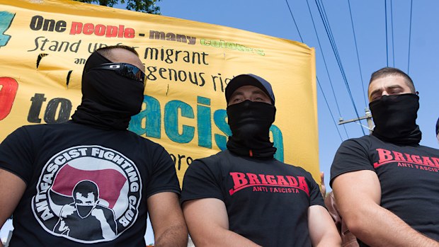 New laws are being introduced to deal with masked protesters. (AAP)